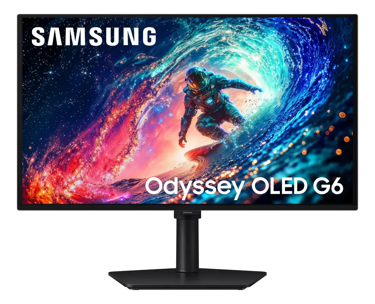 Monitor Samsung Odyssey OLED G6 negro de frente, con un astronauta surfeando una ola de luz azul y rosada en la pantalla, el logo Samsung y el texto Odyssey OLED G6; pie de columna con base rectangular