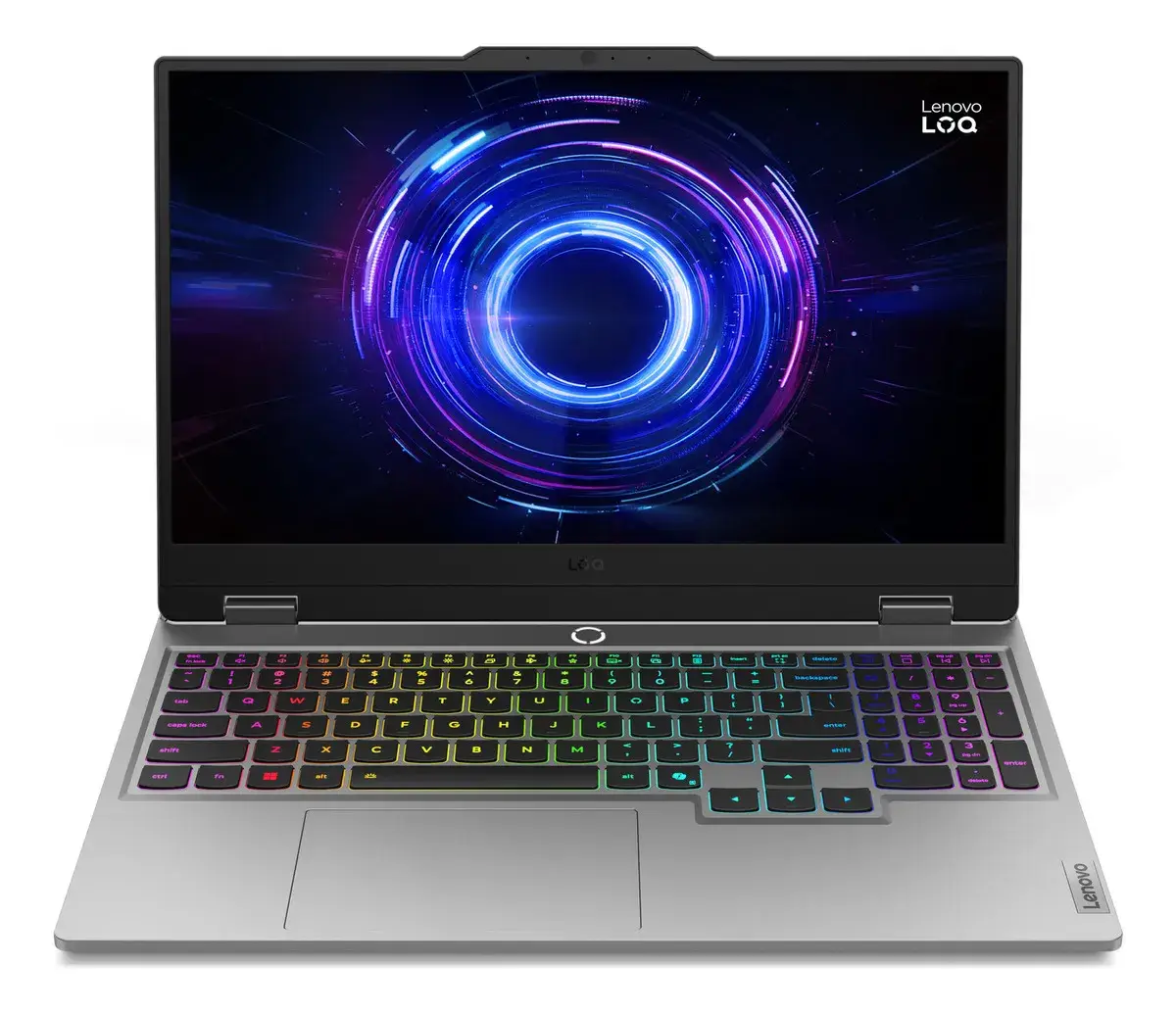 Notebook Lenovo LOQ gris claro de frente con el teclado iluminado en colores de arcoíris; la pantalla muestra anillos de luz azul y morada sobre fondo negro, con el texto Lenovo LOQ en la esquina superior derecha
